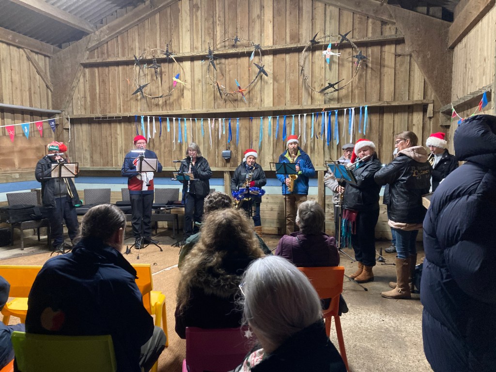 A festive carol service was held at Home Farm, Arlington, Devon on 17 December 2025. Credit: John Mann
